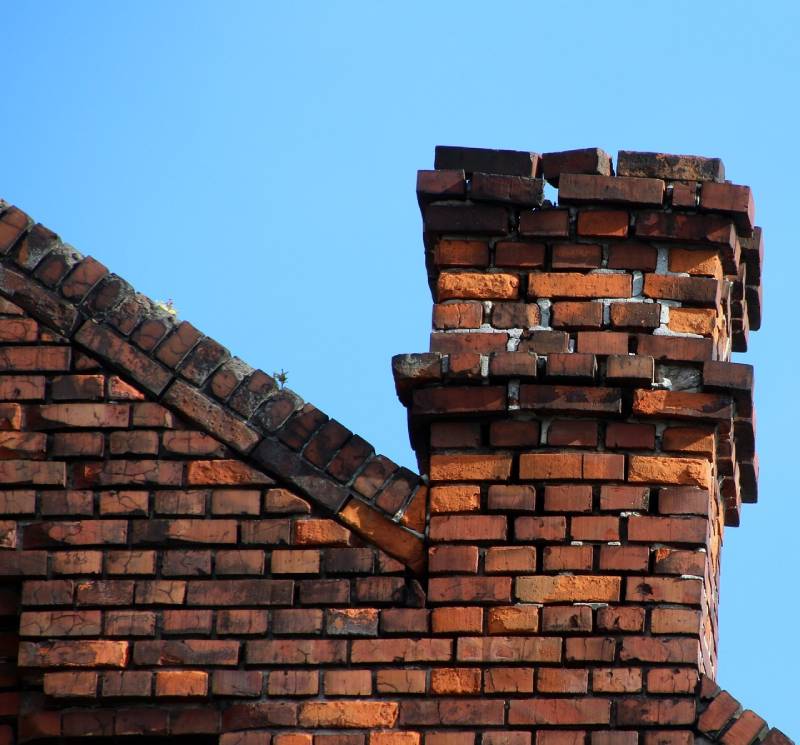 Signs Your Brookfield Home Needs a Chimney Inspection Damaged chimney on an Brookfield home showing cracks and missing mortar